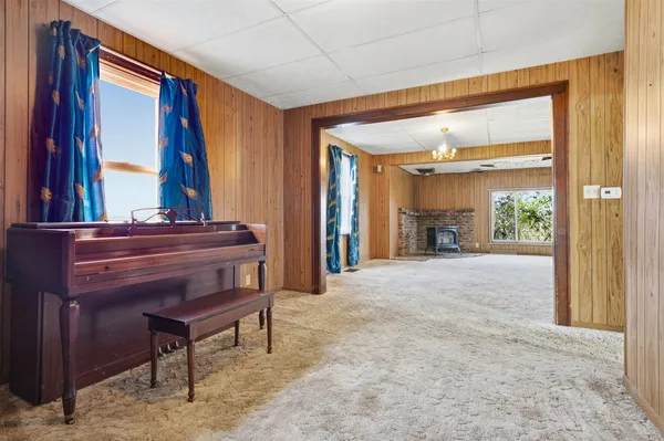 a view of room with furniture and a window