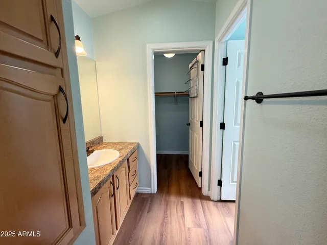 a bathroom with a sink a mirror and a toilet