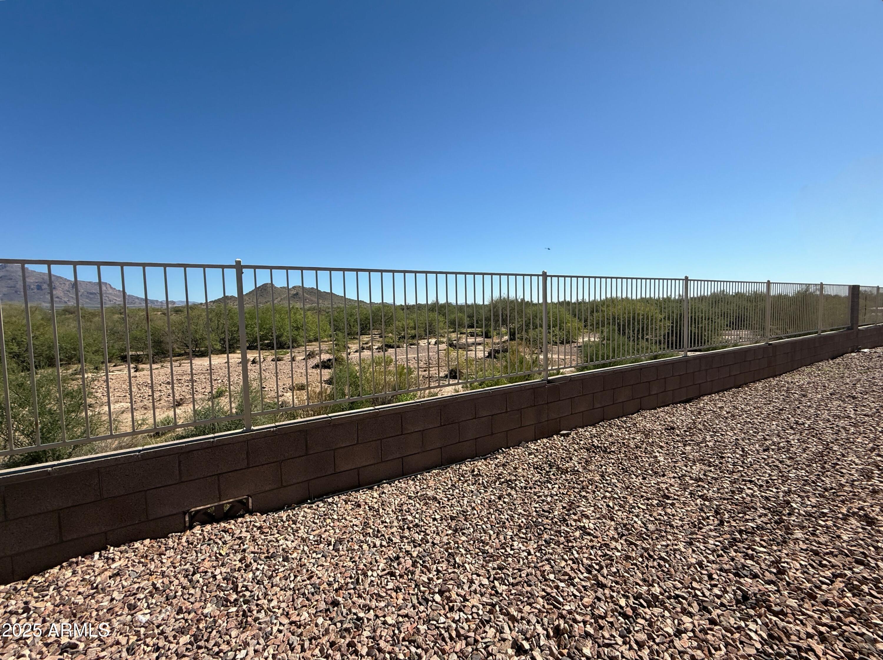 3301 South Goldfield Road, Unit 5078 Apache Junction, AZ 85119 - Photo 35 of 46 a view of balcony with wooden floor