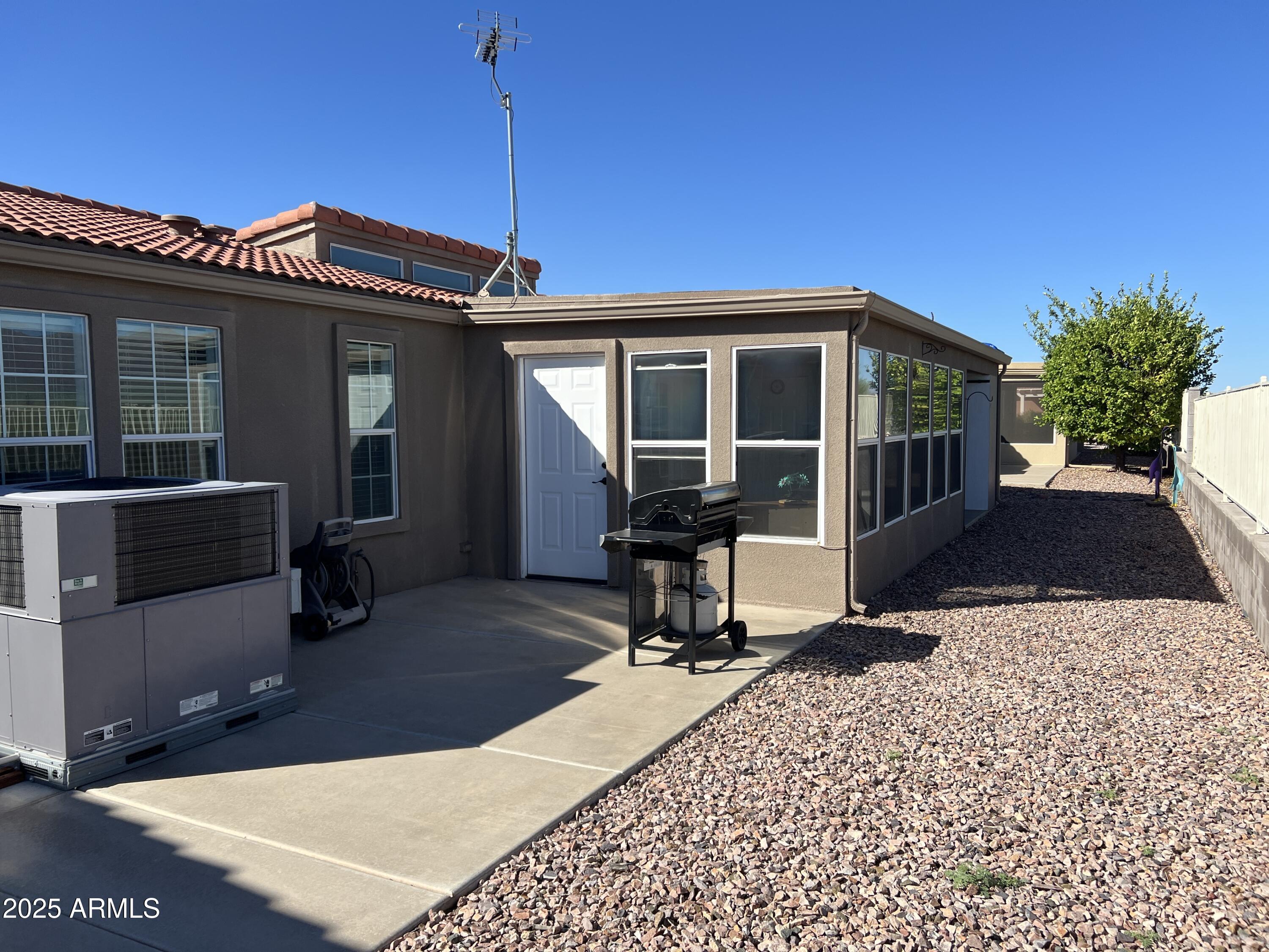 3301 South Goldfield Road, Unit 5078 Apache Junction, AZ 85119 - Photo 36 of 46 a view of a house with a patio