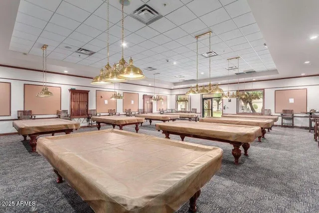 a room with lots of table and chairs