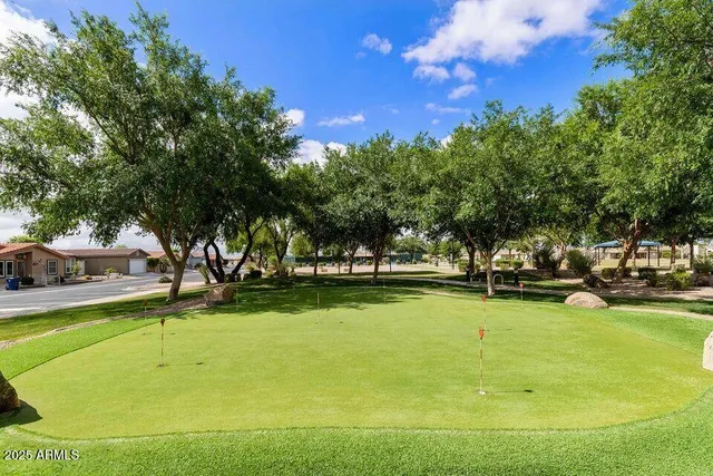 a view of a swimming pool with an outdoor space and seating area