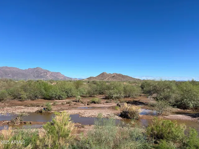 a view of a lake with mountains in the background