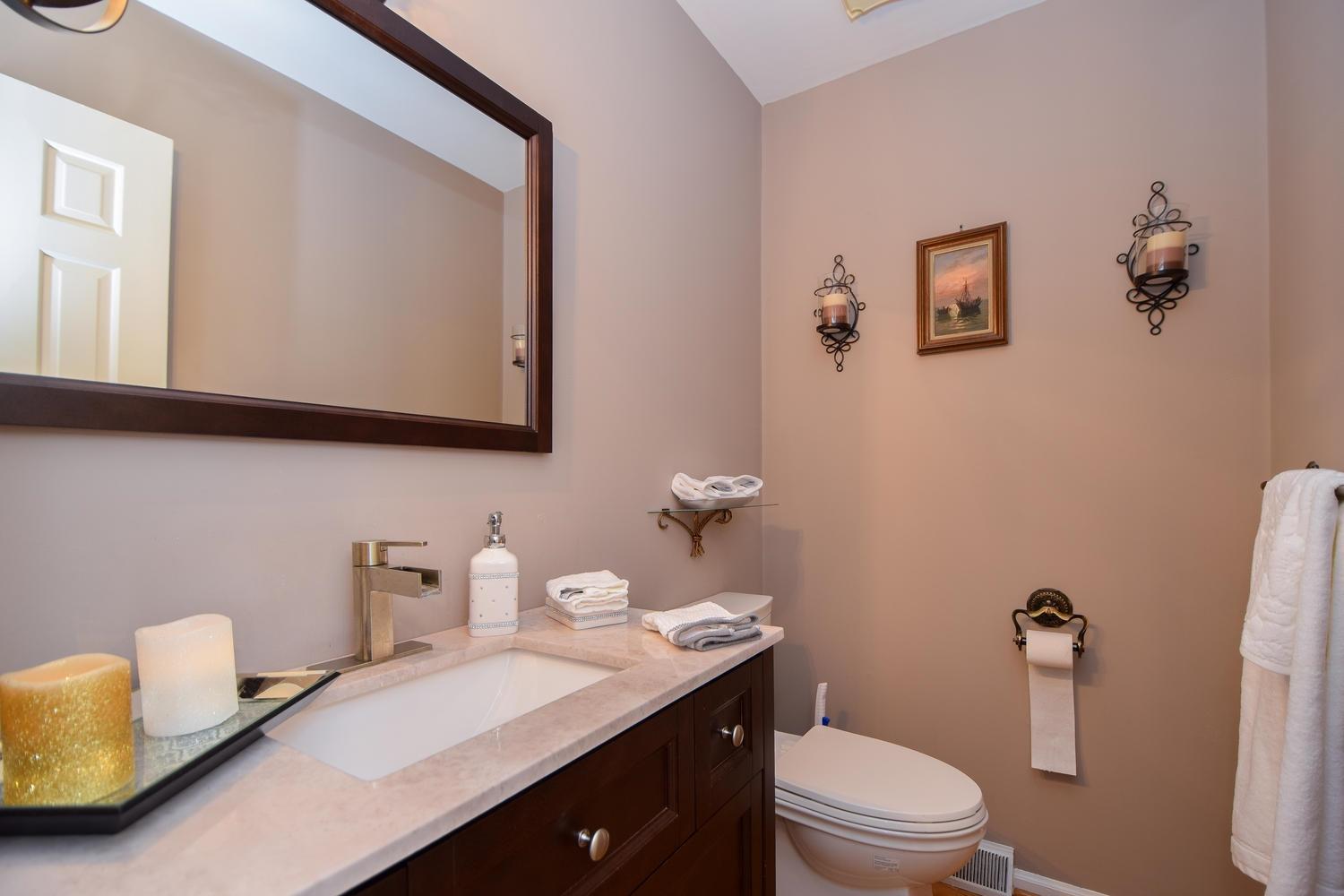 5222 Falcon Ridge Road Roanoke, VA 24018 - Photo 14 of 40 a bathroom with a toilet a sink and mirror