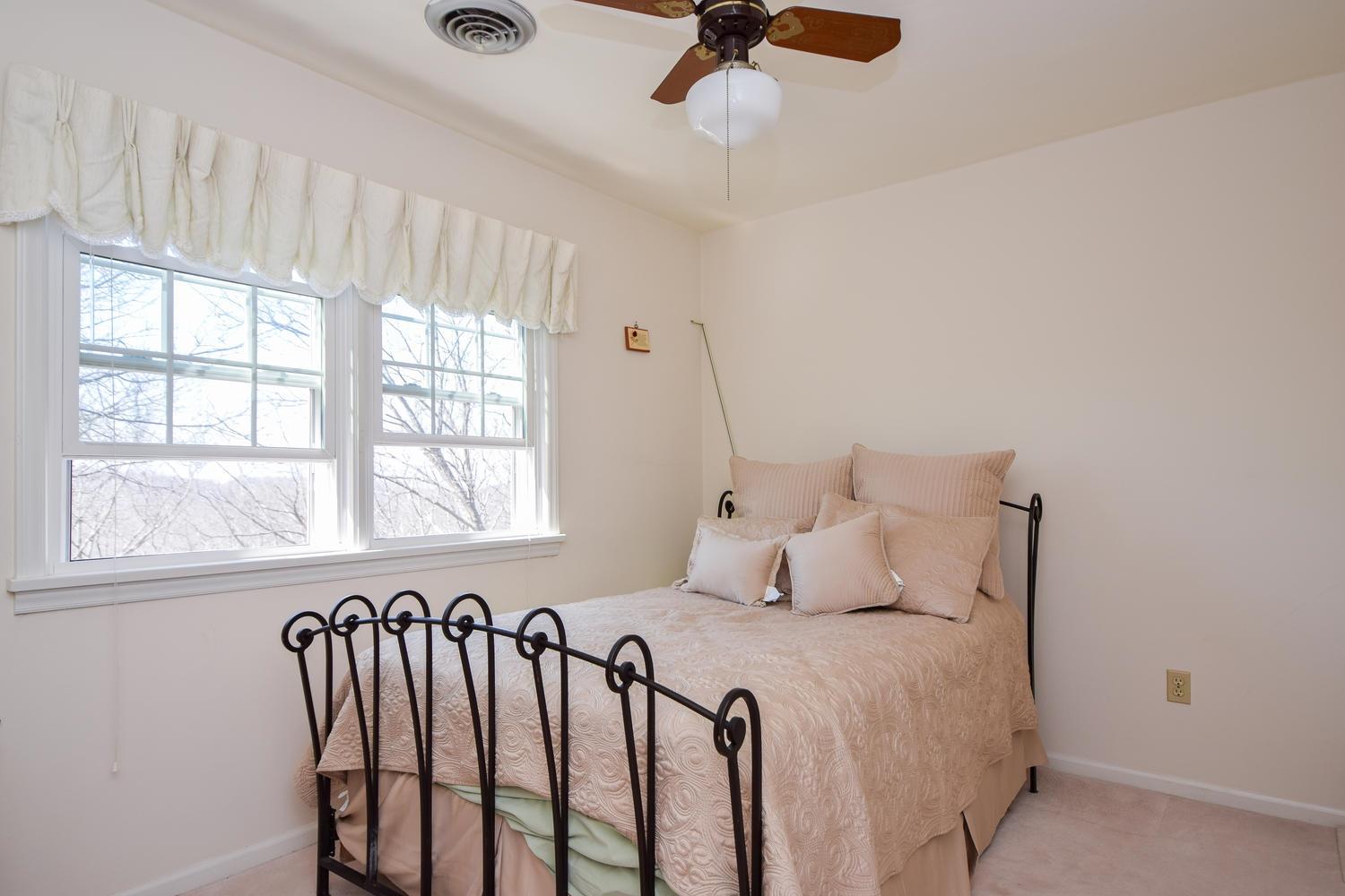 5222 Falcon Ridge Road Roanoke, VA 24018 - Photo 19 of 40 a bedroom with a bed and a window