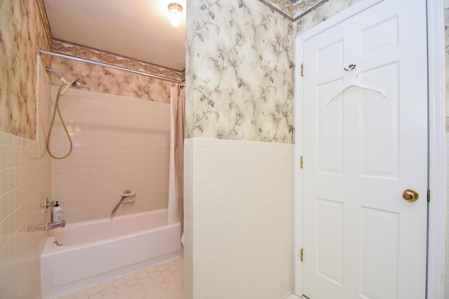 5222 Falcon Ridge Road Roanoke, VA 24018 - Photo 23 of 40 a bathroom with a shower and a bath tub