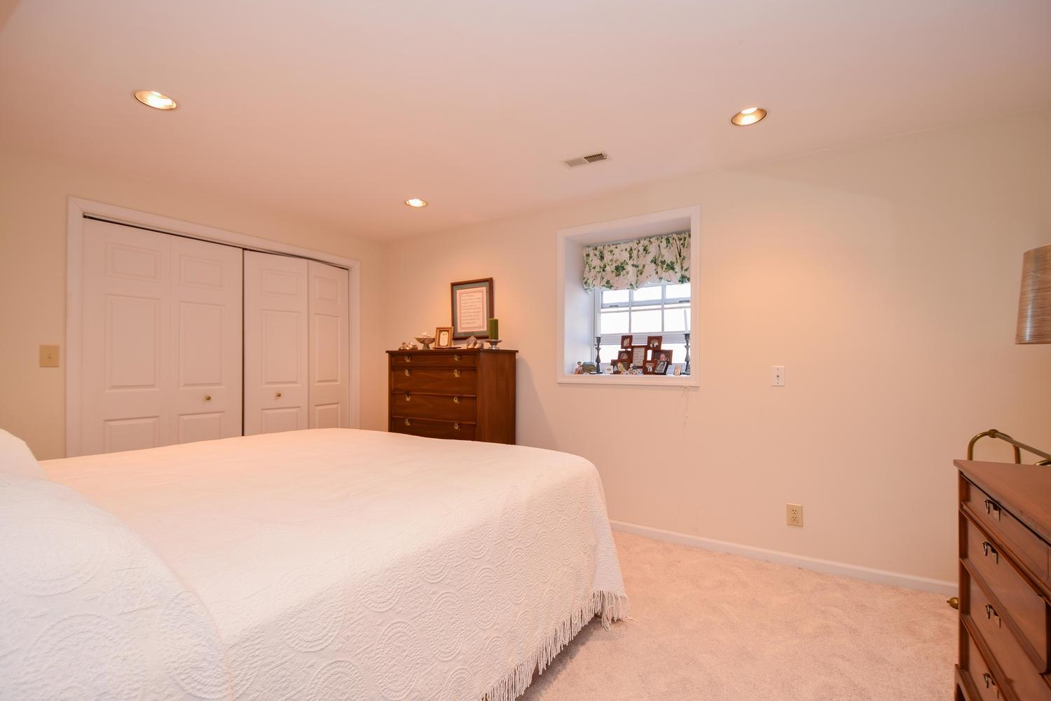 5222 Falcon Ridge Road Roanoke, VA 24018 - Photo 29 of 40 a large bedroom with a bed and a closet