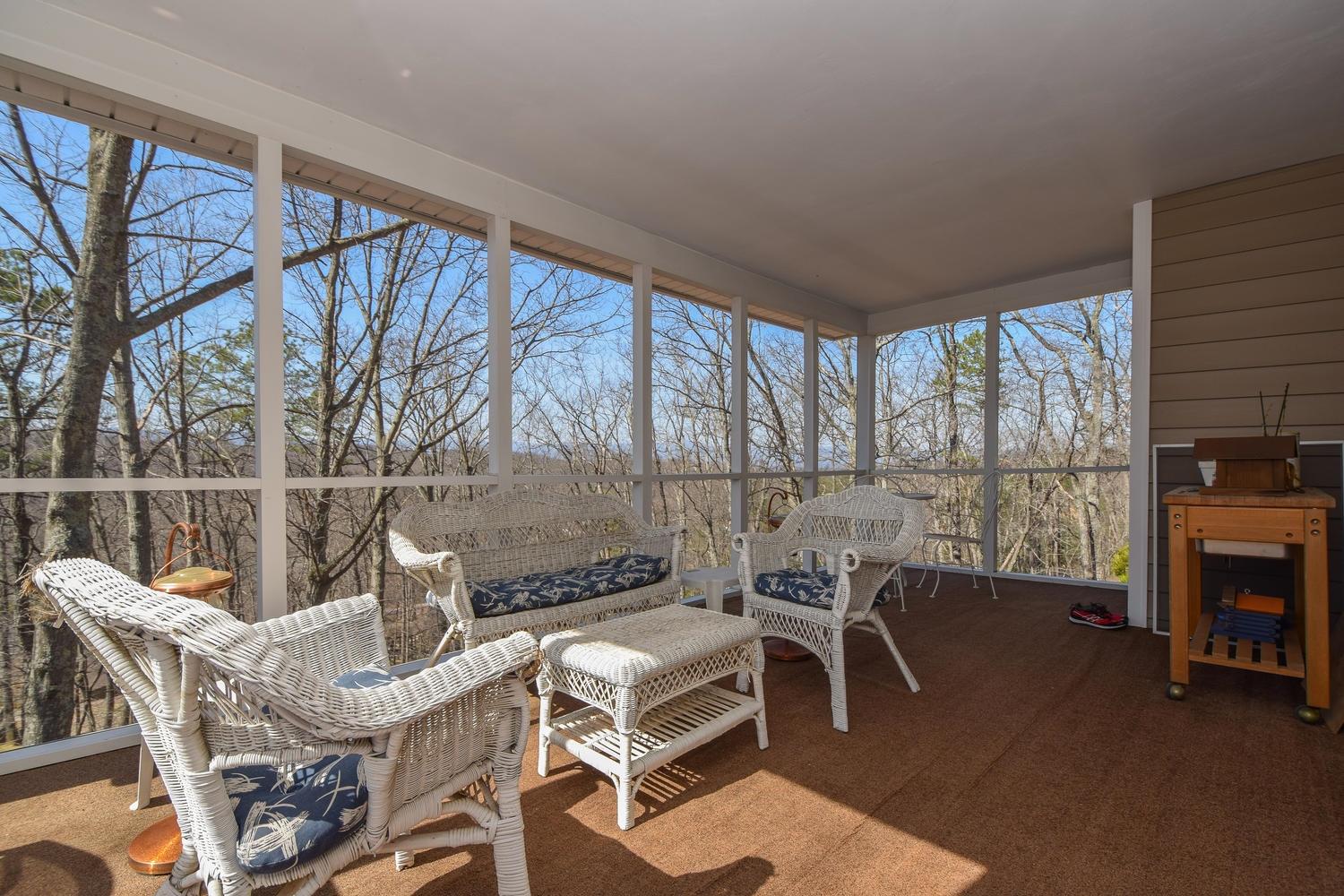 5222 Falcon Ridge Road Roanoke, VA 24018 - Photo 32 of 40 a living room with a fireplace a flat screen tv and a large window