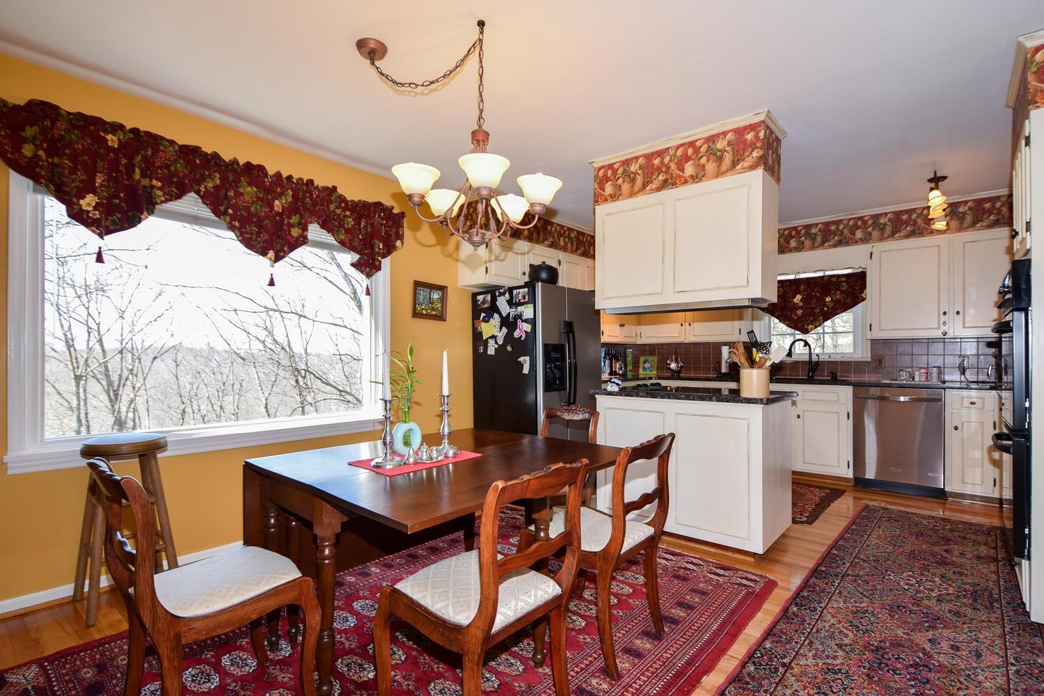 5222 Falcon Ridge Road Roanoke, VA 24018 - Photo 7 of 40 a view of a dining room with furniture and wooden floor
