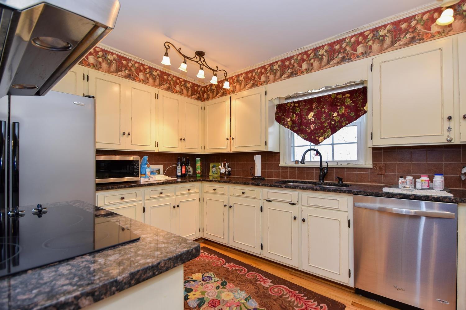 5222 Falcon Ridge Road Roanoke, VA 24018 - Photo 8 of 40 a kitchen with a sink cabinets and window