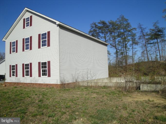 3975 Solomons Island Road North Huntingtown, MD 20639 - Photo 14 of 30 a front view of a house with plants