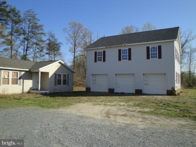 3975 Solomons Island Road North Huntingtown, MD 20639 - Photo 22 of 30 a view of a house with a yard