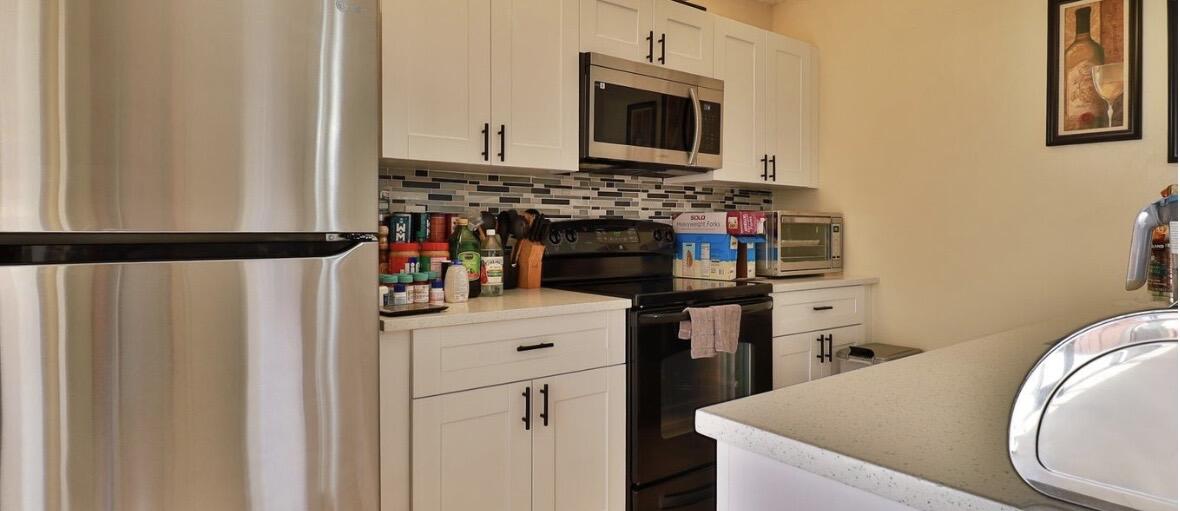 1034 Springdale Circle Palm Springs, FL 33461 - Photo 12 of 16 KITCHEN 3