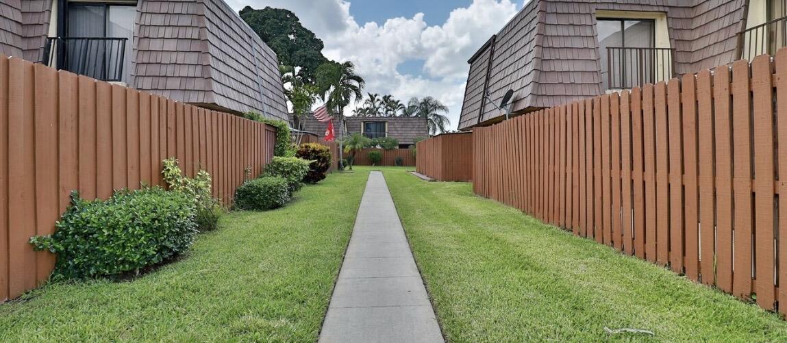 1034 Springdale Circle Palm Springs, FL 33461 - Photo 3 of 16 HOUSE FRONT