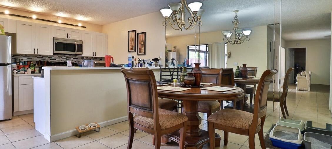 1034 Springdale Circle Palm Springs, FL 33461 - Photo 8 of 16 DINING AREA