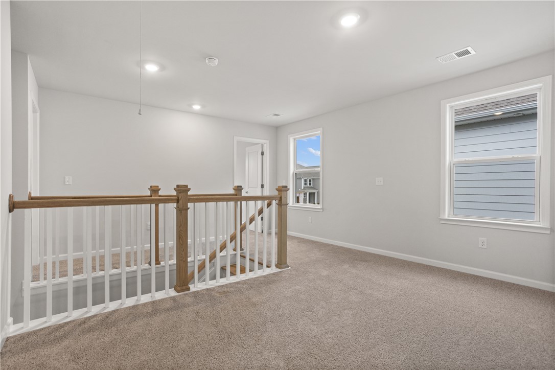 631 Sweetspire Trail, Unit 148 Seneca, SC 29678 - Photo 18 of 36 A spacious landing with soft carpeting and natural light from well-placed windows.