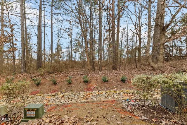 a view of a house with a door and wooden walls