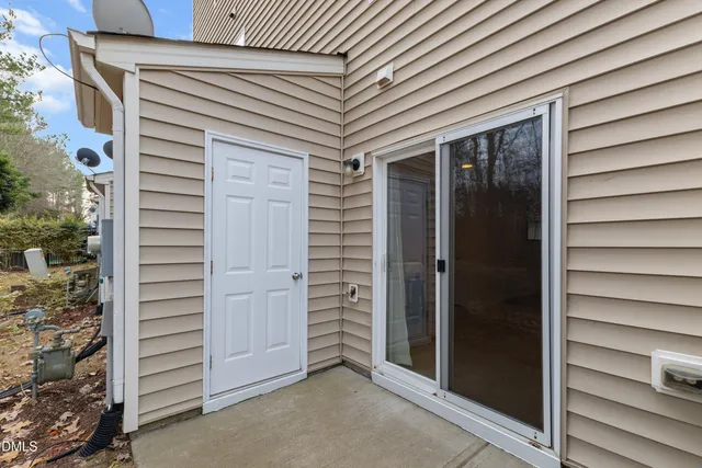 a view of a house with brick walls