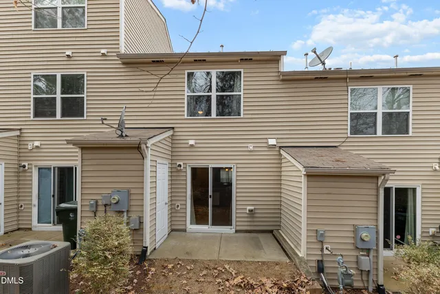 a view of a swimming pool with an outdoor space and seating area