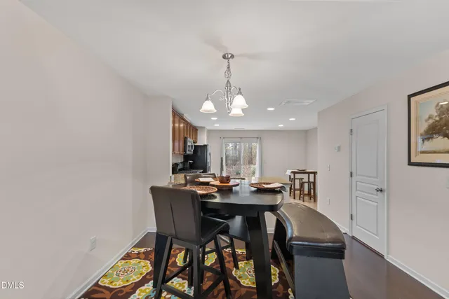 a dining room with a table and chairs