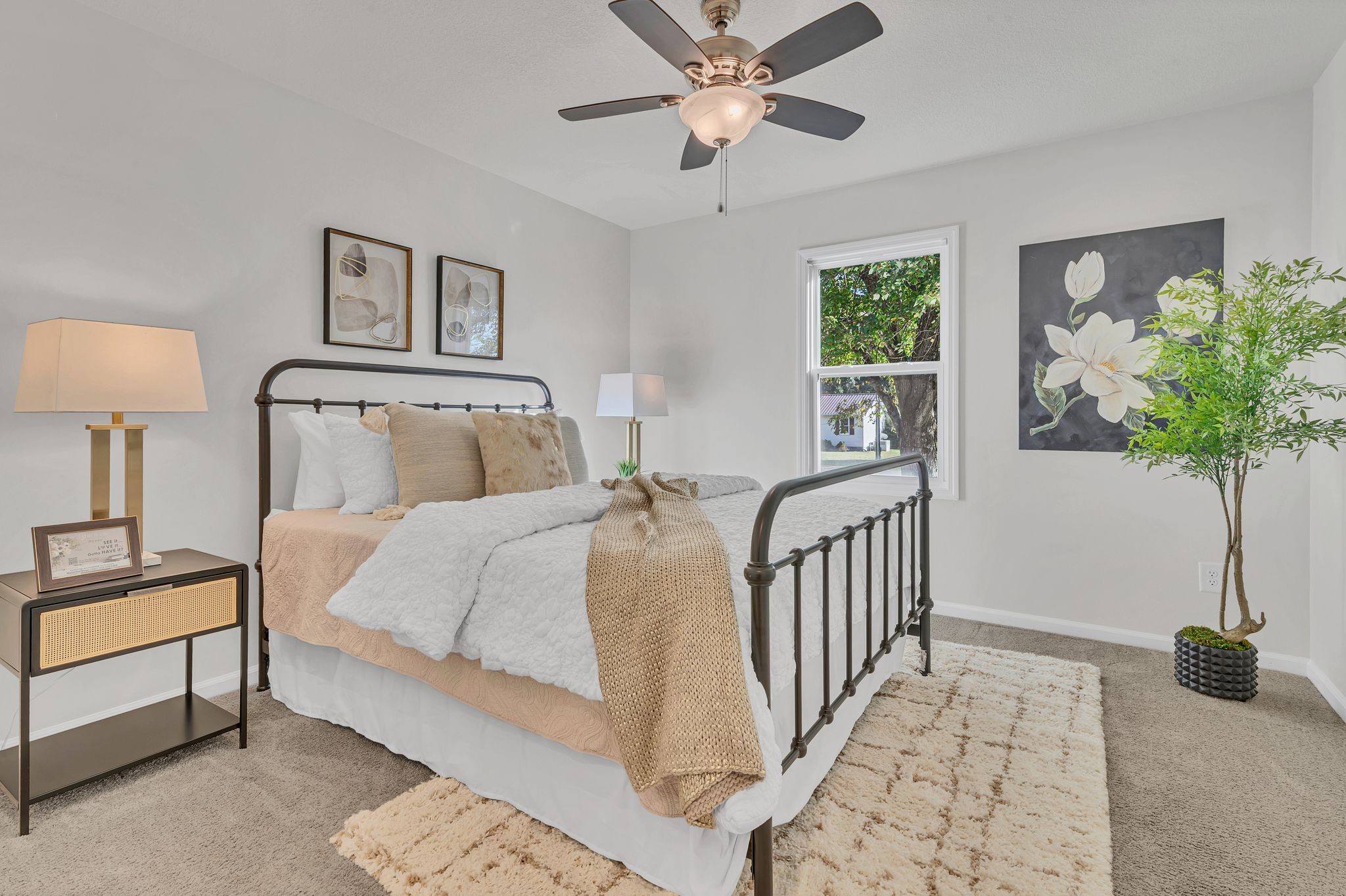 44 Flint Drive Decherd, TN 37324 - Photo 12 of 31 a bedroom with a bed lamp and a potted plant