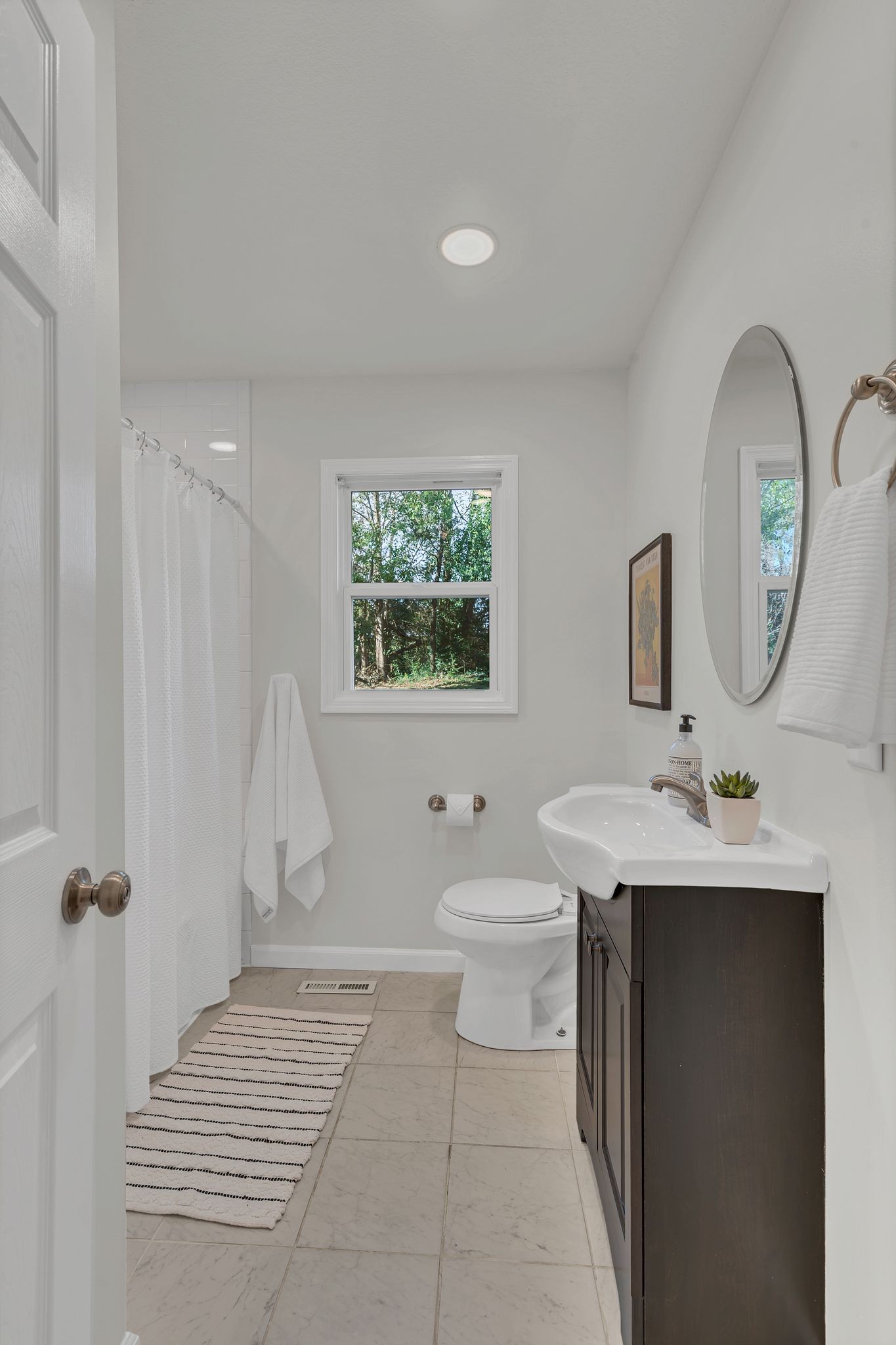 44 Flint Drive Decherd, TN 37324 - Photo 14 of 31 a bathroom with a toilet a sink and a mirror