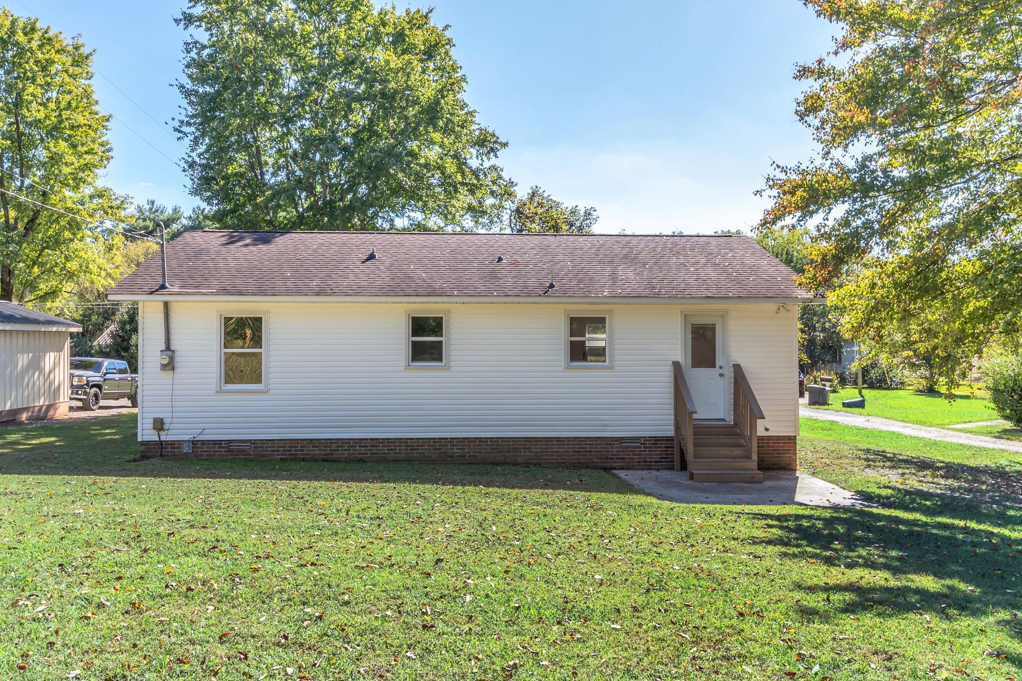 44 Flint Drive Decherd, TN 37324 - Photo 29 of 31 a view of a house with a backyard
