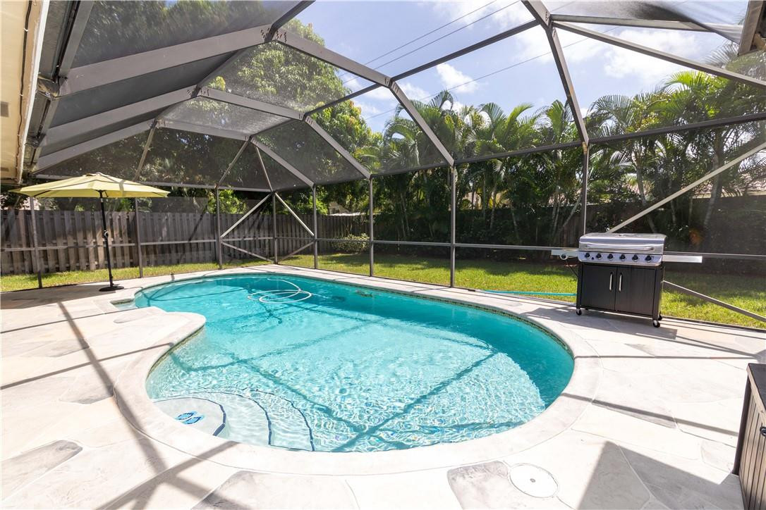 1270 Southwest 19th Street Boca Raton, FL 33486 - Photo 27 of 37 Screened in Large Pool and Patio