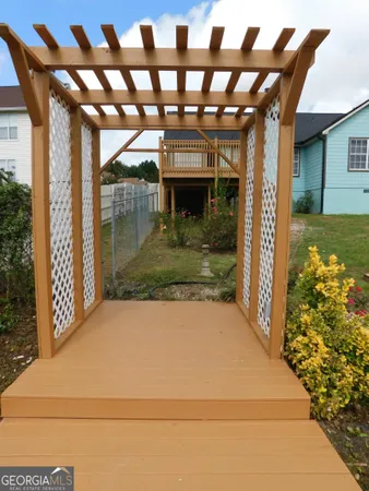 a view of a porch with a table and chairs