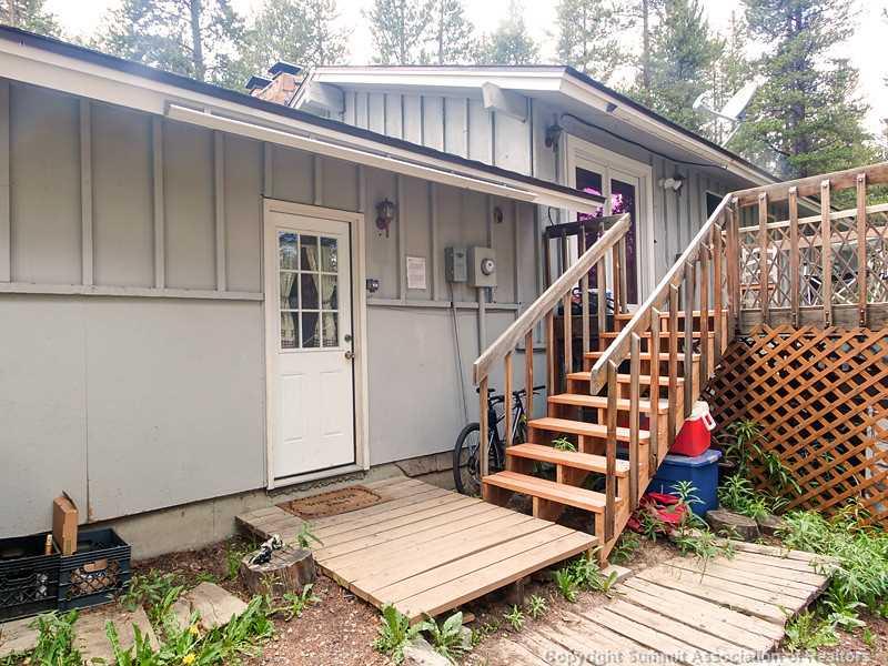 43 Red Feather Road Breckenridge, CO 80424 - Photo 11 of 12 a view of a deck with wooden floor and fence