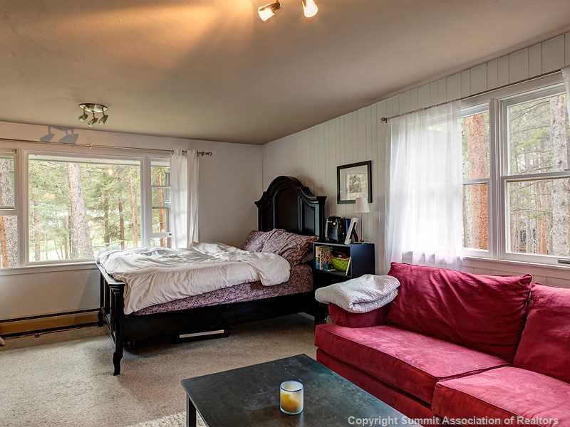 43 Red Feather Road Breckenridge, CO 80424 - Photo 3 of 12 a bedroom with bed couch and window