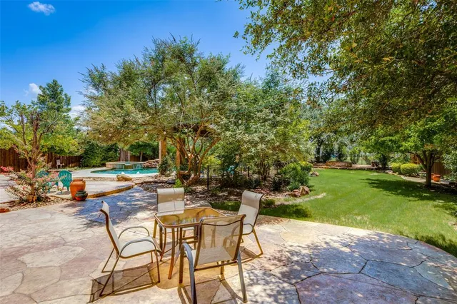 a view of a backyard with sitting area
