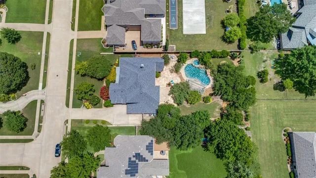 an aerial view of a house with outdoor space and lake view
