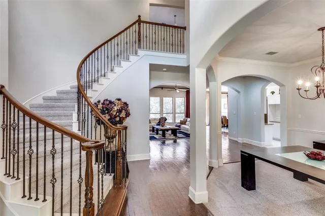 a view of entryway livingroom and hall with wooden floor