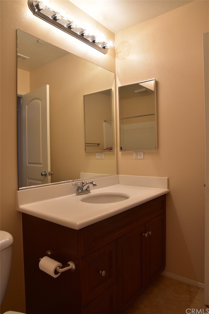 75 Courant Irvine, CA 92618 - Photo 18 of 27 a bathroom with a sink and a mirror