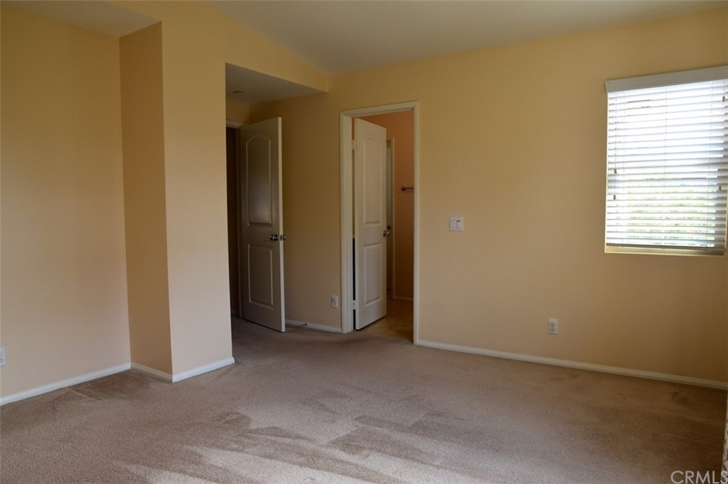 75 Courant Irvine, CA 92618 - Photo 19 of 27 a view of an empty room with closet and a window