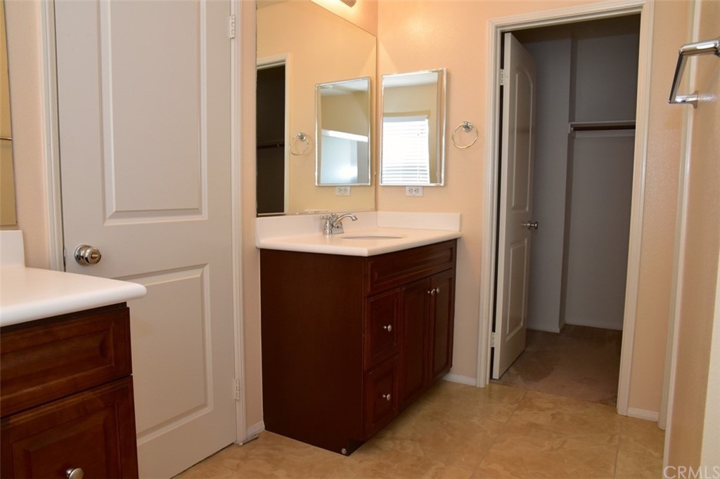 75 Courant Irvine, CA 92618 - Photo 22 of 27 a bathroom with a sink and a mirror