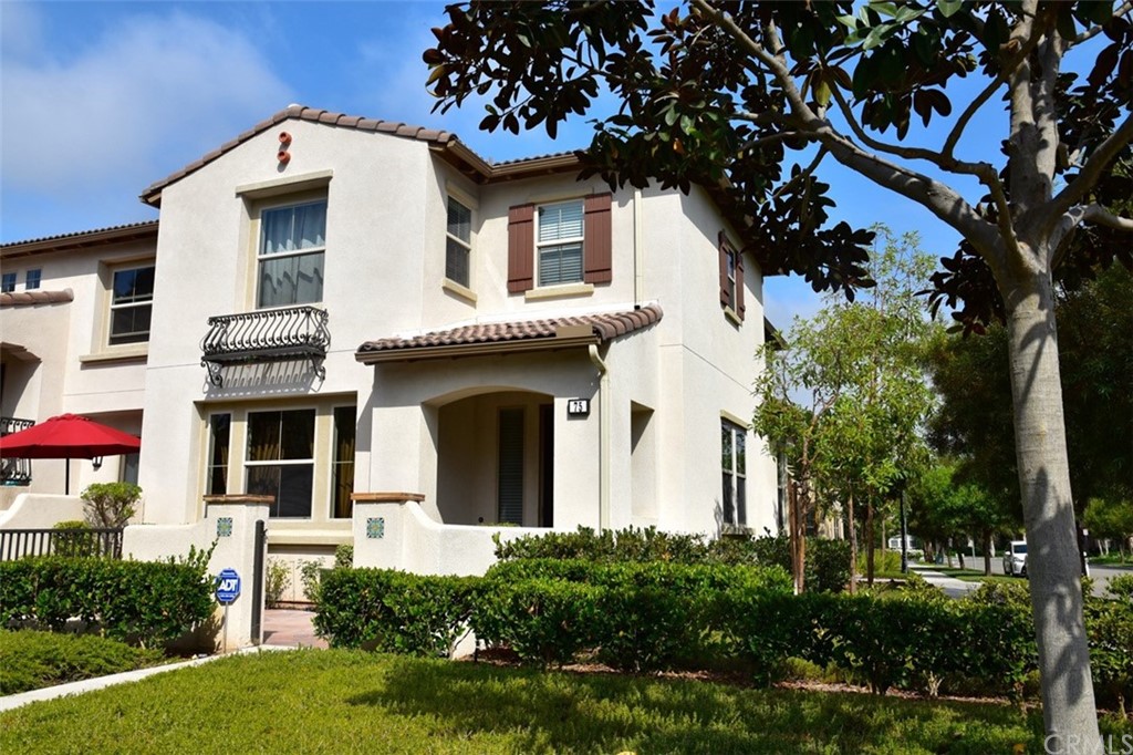 75 Courant Irvine, CA 92618 - Photo 25 of 27 a front view of a house with a yard
