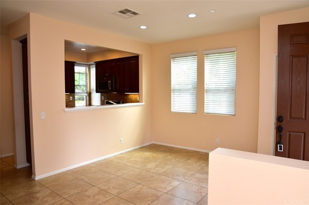 75 Courant Irvine, CA 92618 - Photo 4 of 27 a view of an empty room with window and cabinet