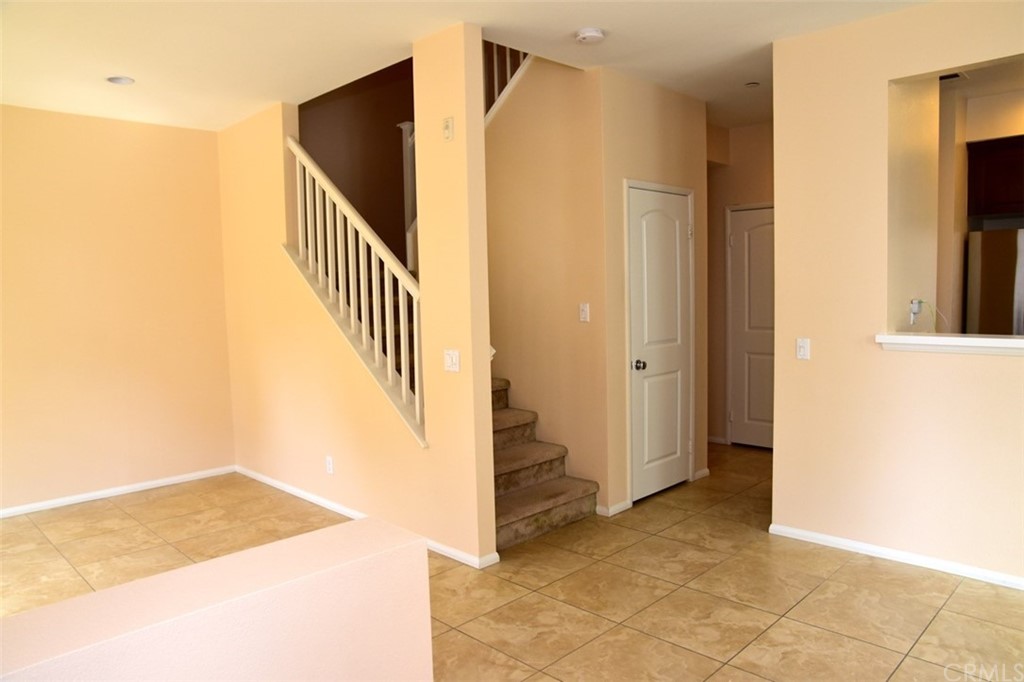 75 Courant Irvine, CA 92618 - Photo 5 of 27 a view of entryway and hall with wooden floor