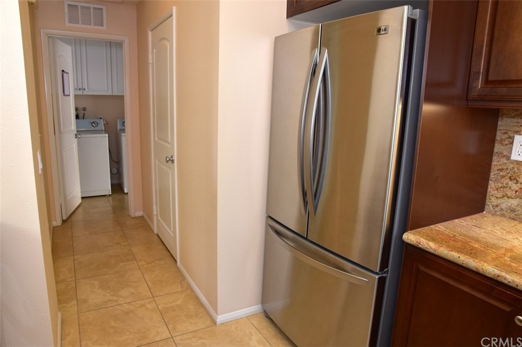 75 Courant Irvine, CA 92618 - Photo 7 of 27 a view of a kitchen with a refrigerator and a sink