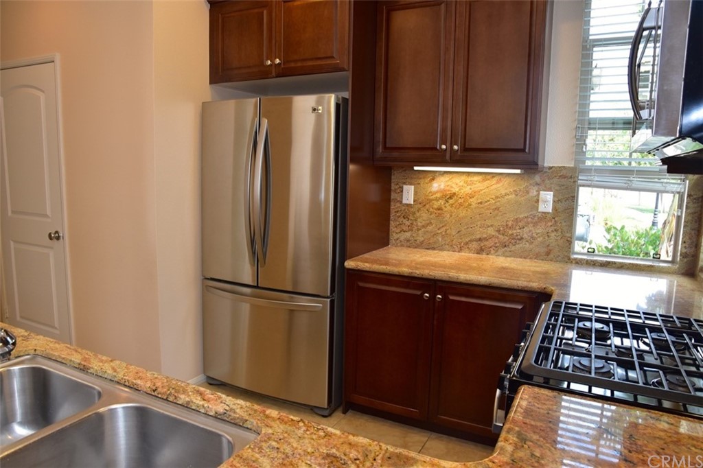 75 Courant Irvine, CA 92618 - Photo 8 of 27 a kitchen with a refrigerator and a sink