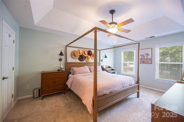 a a bedroom with a bed and window