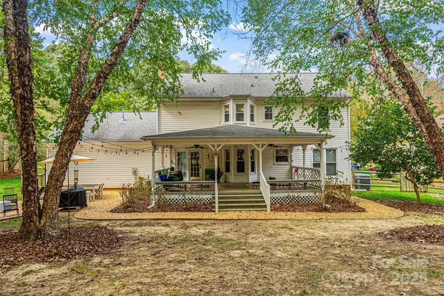 a backyard of a house with garden and deck