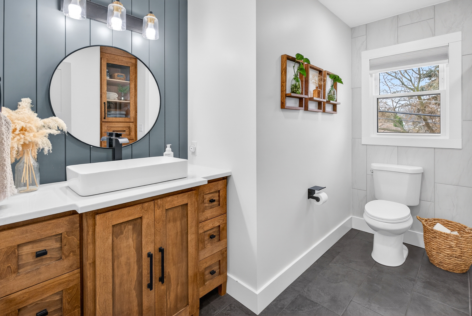 327 30th Avenue North Clinton, IA 52732 - Photo 13 of 38 a bathroom with a toilet a sink and a mirror