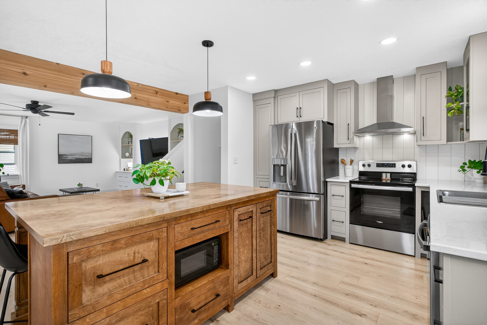 327 30th Avenue North Clinton, IA 52732 - Photo 5 of 38 a kitchen with a sink stainless steel appliances and wooden floor