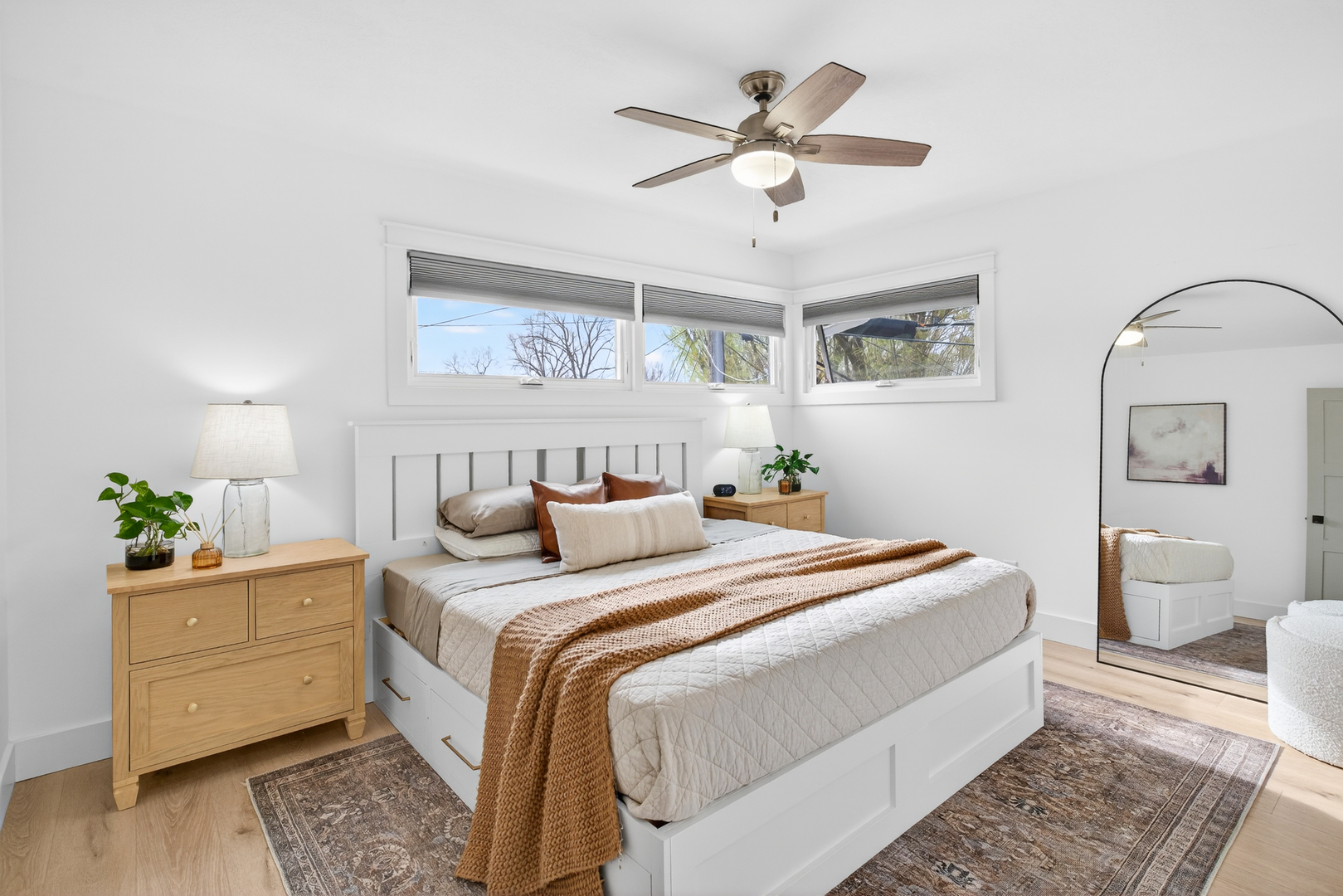 327 30th Avenue North Clinton, IA 52732 - Photo 8 of 38 a bedroom with a bed and a chandelier
