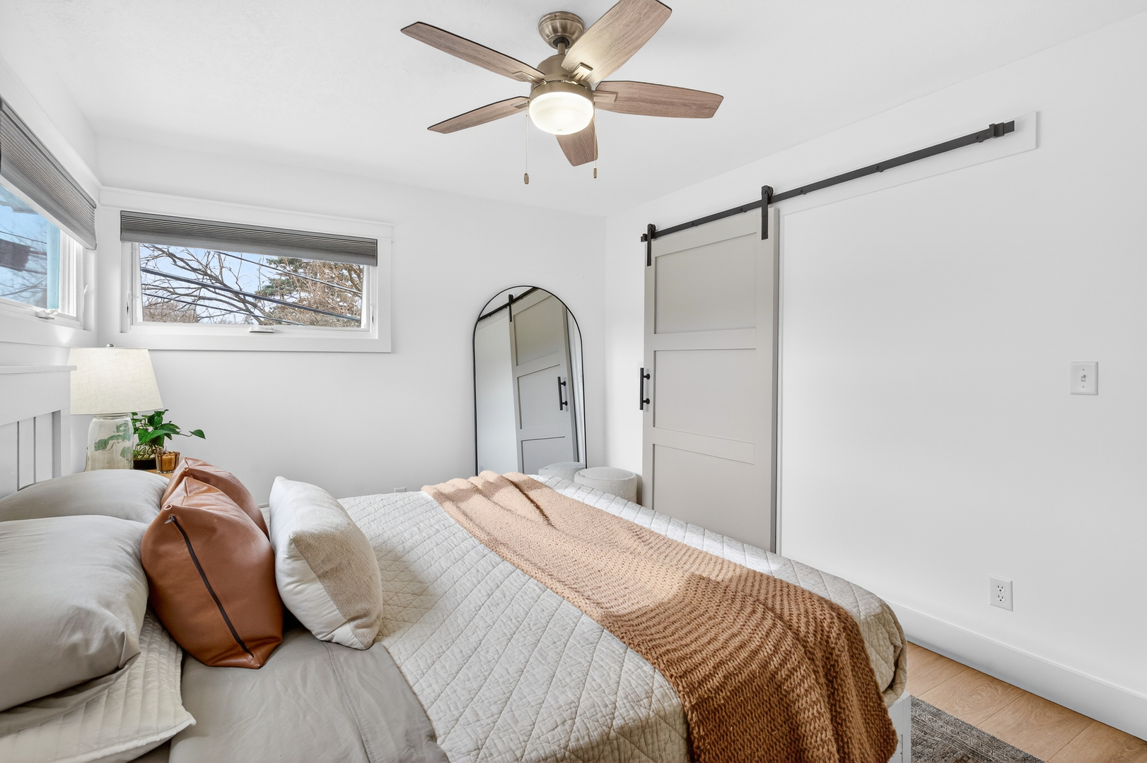 327 30th Avenue North Clinton, IA 52732 - Photo 9 of 38 a bedroom with a bed and a chandelier