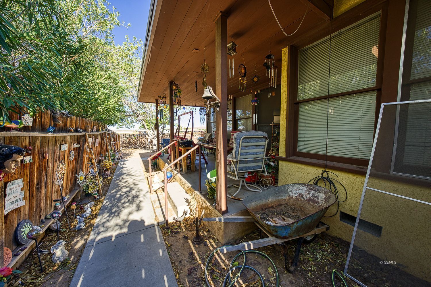 112 South Valley Street Ridgecrest, CA 93555 - Photo 2 of 19 a view of deck with patio table and chairs