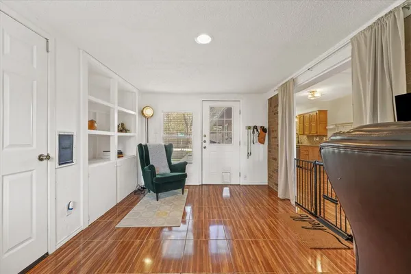 a bathroom with a granite countertop sink mirror vanity and toilet